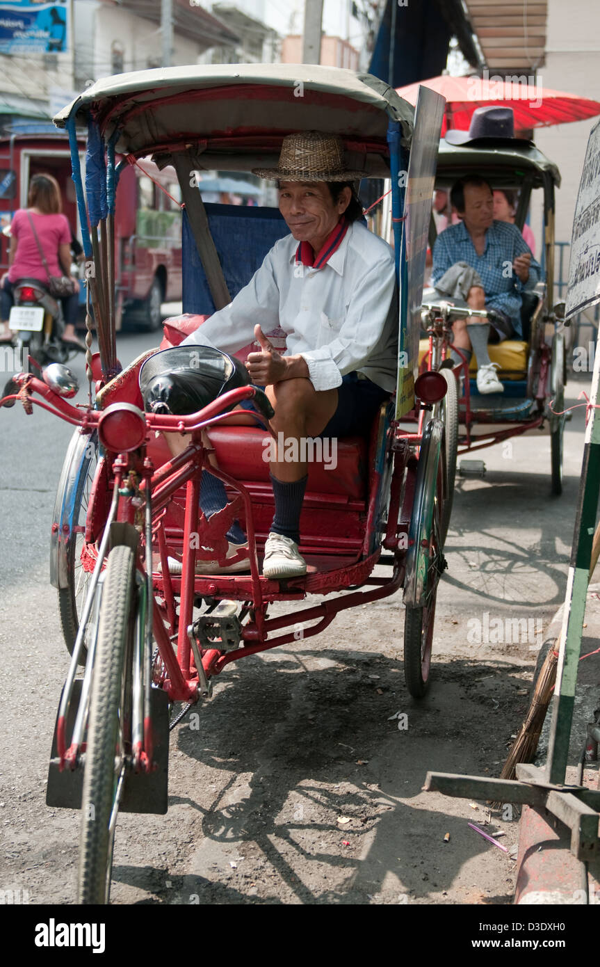 Chiang Mai, Thailand, a friendly rickshaw driver waits for Passengers Stock Photo