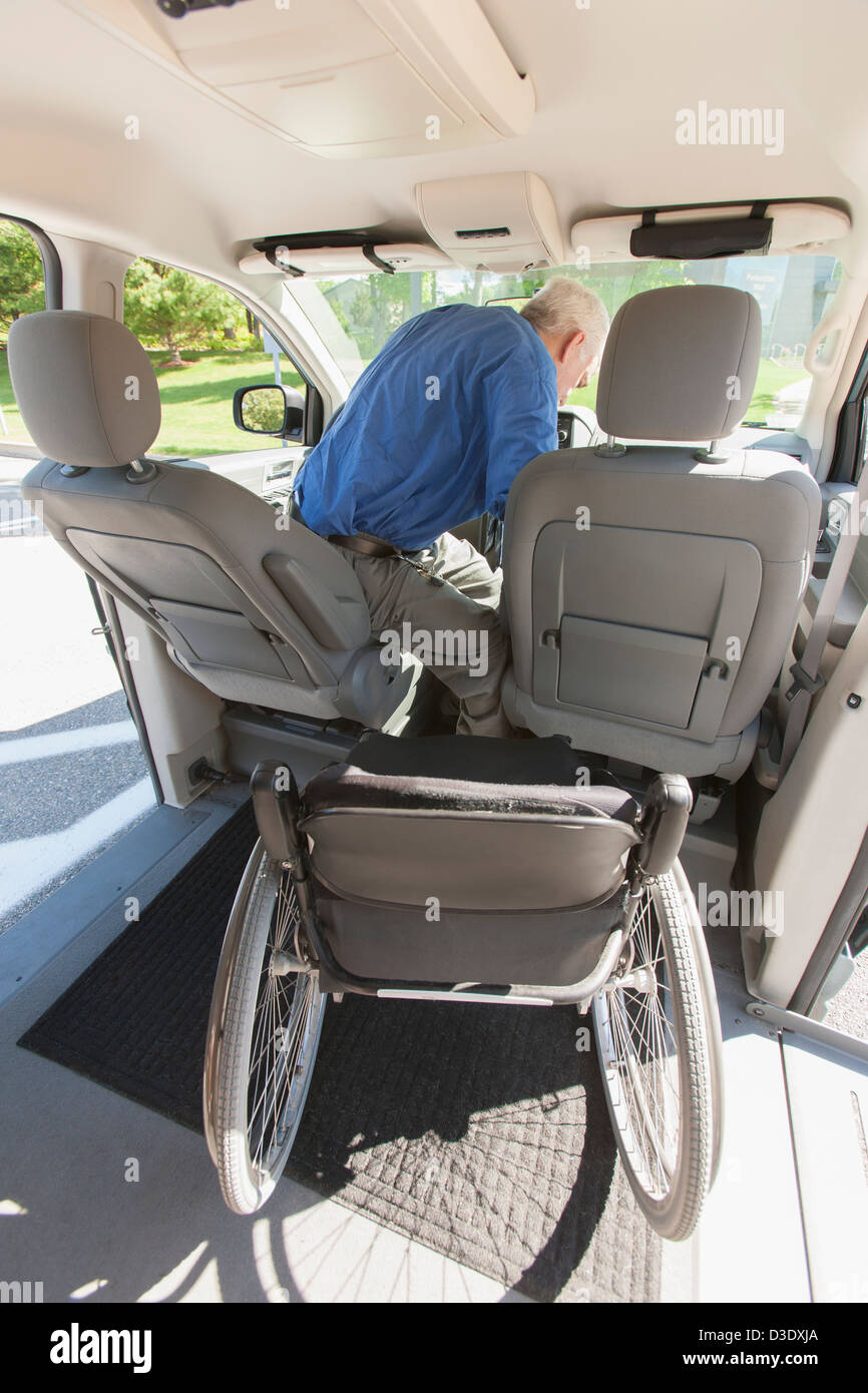 Man with muscular dystrophy and diabetes on the driving seat in an
