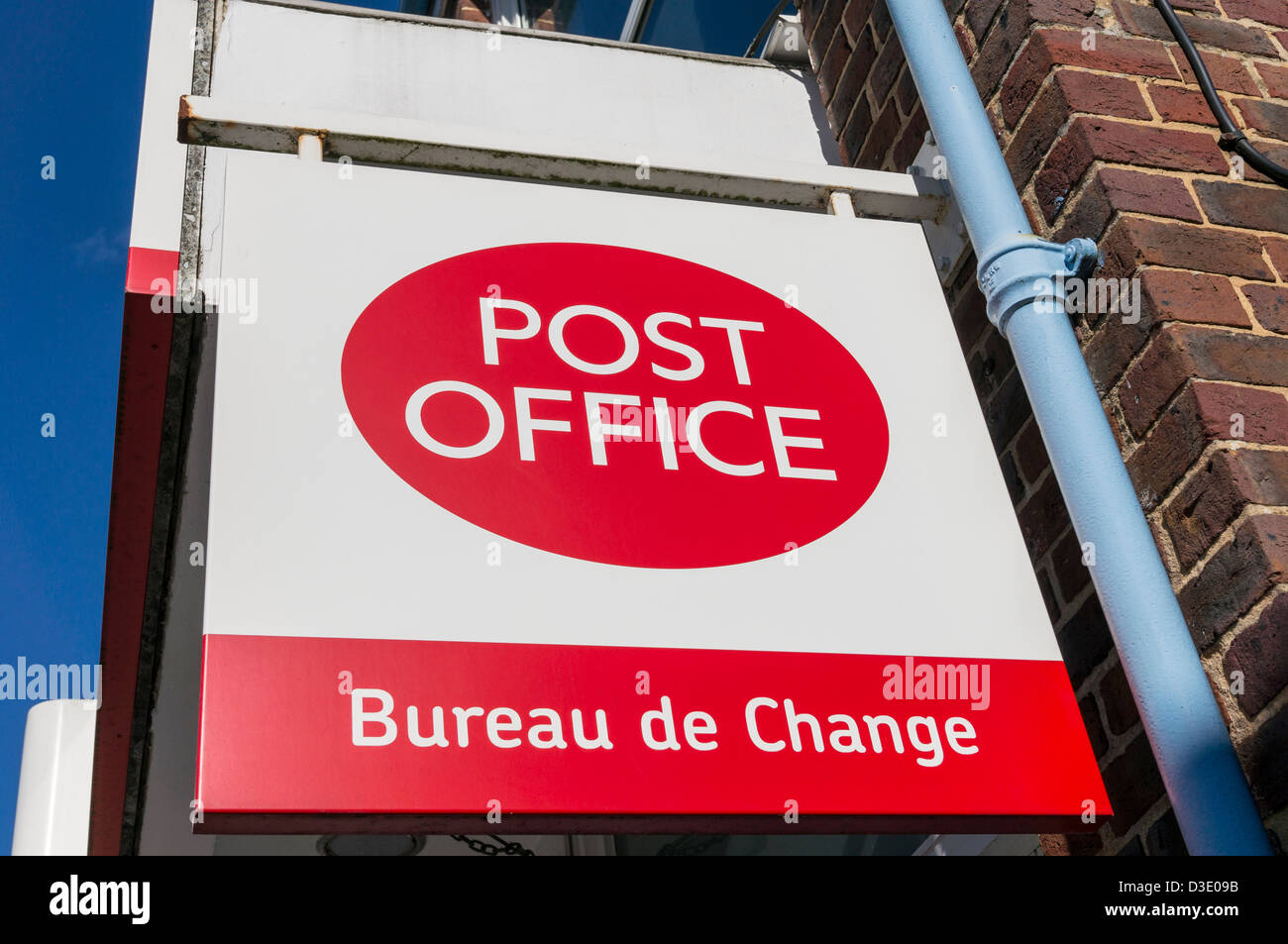 Looking up at UK Post Office and Bureau de Change sign Stock Photo