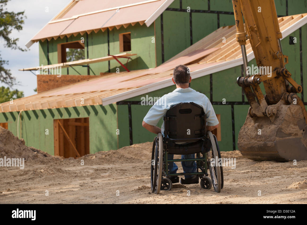 Man with spinal cord injury in a wheelchair at his new accessible home ...