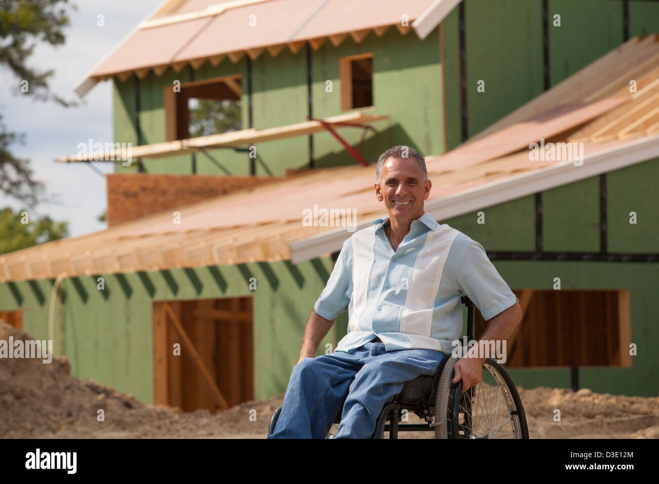 Man with spinal cord injury in a wheelchair at his new accessible home ...