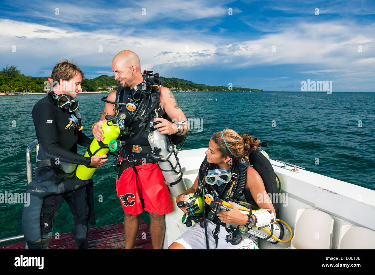 SCUBA Tec divers on boat preparing for multi-tank deep dive Stock Photo