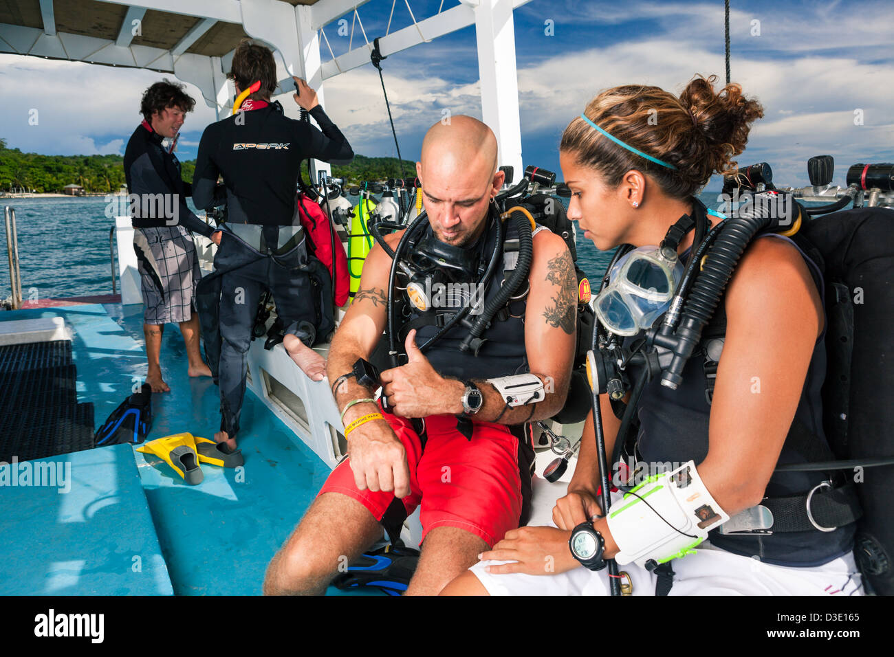 Scuba divers create dive plan on boat before beginning technical dive