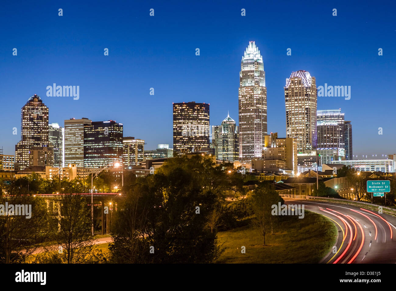 Dusk skyline with traffic streaming, Charlotte, North Carolina Stock Photo