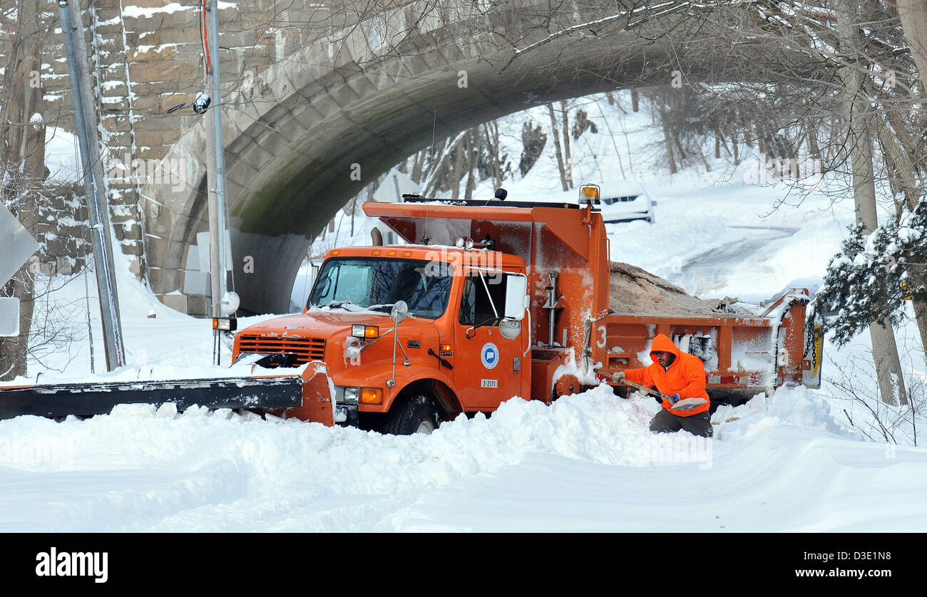 A state DOT driver tries to free his plow on Fountain Street after Nemo, the worst snow storm to hit CT in recorded history Stock Photo