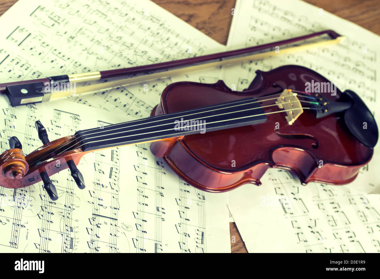 Violin with bow and music sheet Stock Photo