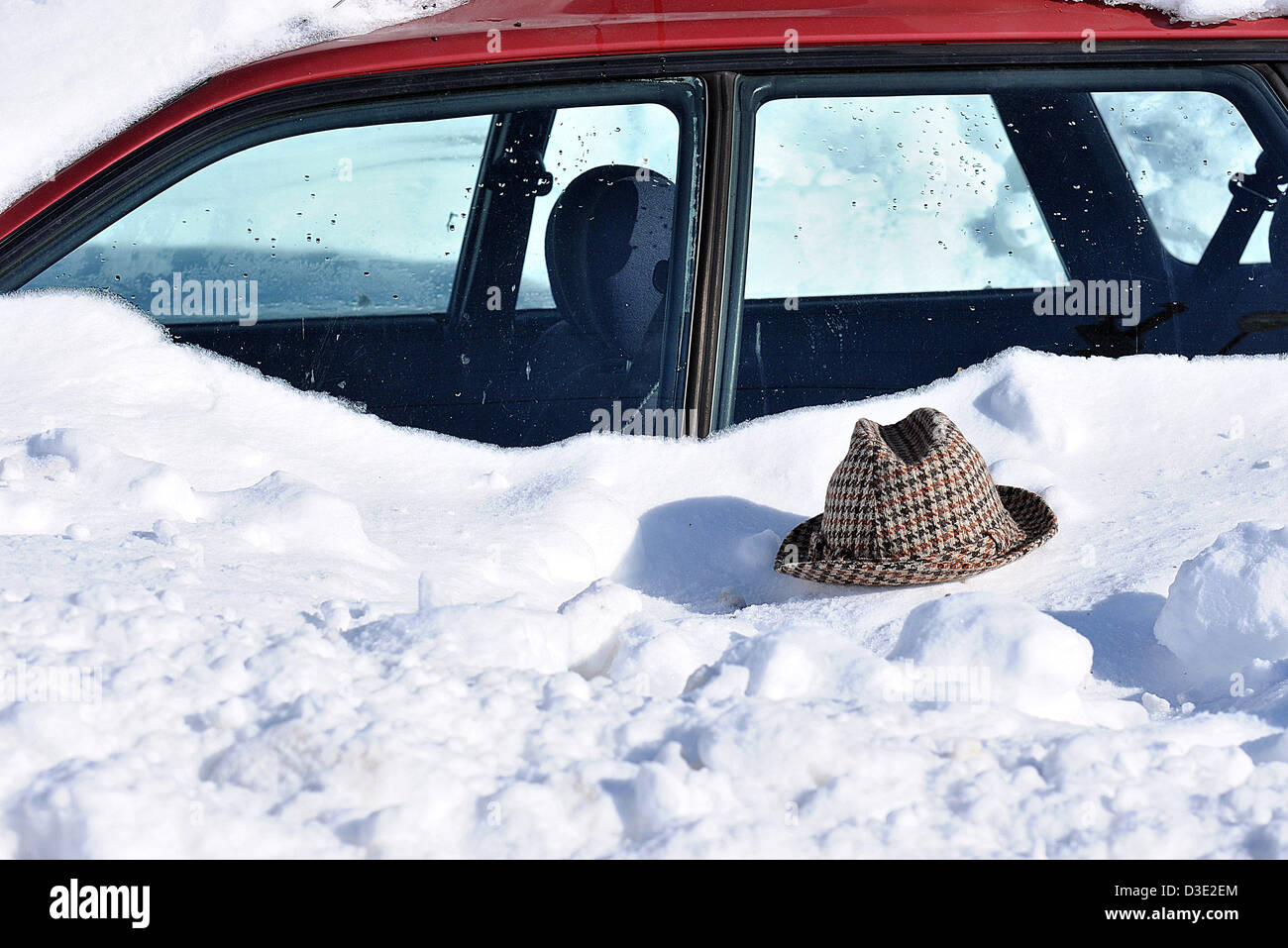 New Haven, CT USA --A hat left by a shoveler looks like a buried man along Fountain Street. 2/9/13 Stock Photo