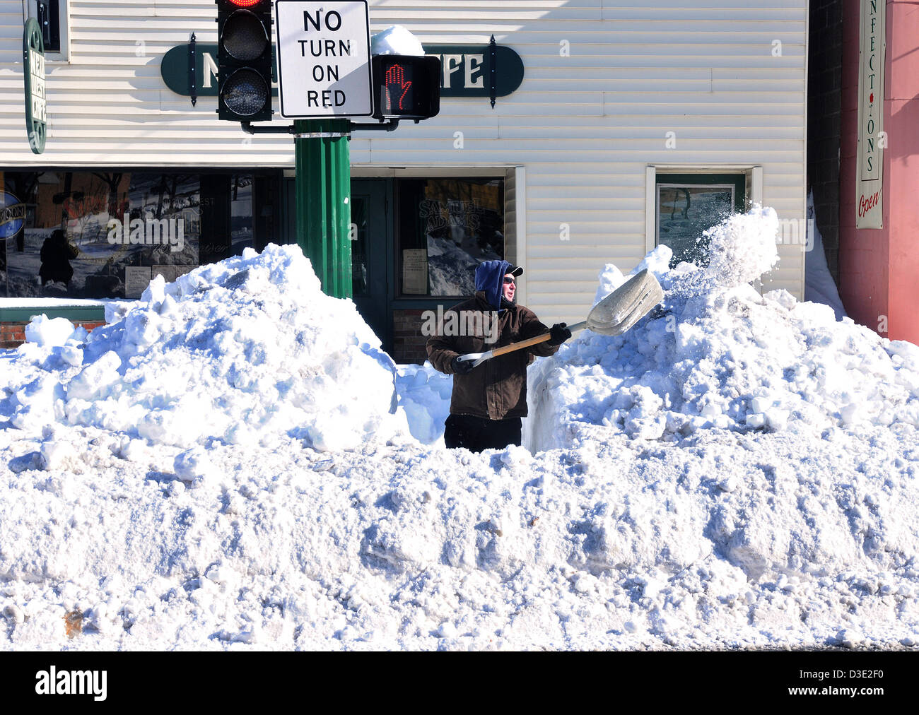 New Haven--A man clears snow along Whalley Avenue and Fountain Street. Stock Photo