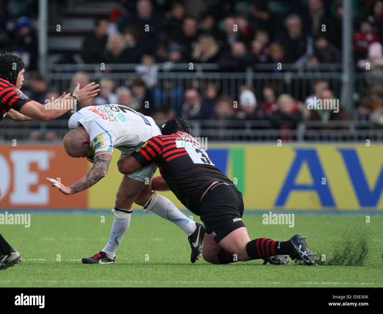 Hendon, North London, UK   Saracens v Exeter Chiefs rugby   February 16, 2013 Matt Stevens (S) slips as the artificial surface kicks up slightly whilst he tackles James Scaysbrook (EC). Pic: Paul Marriott Photography/Alamy Live News Stock Photo