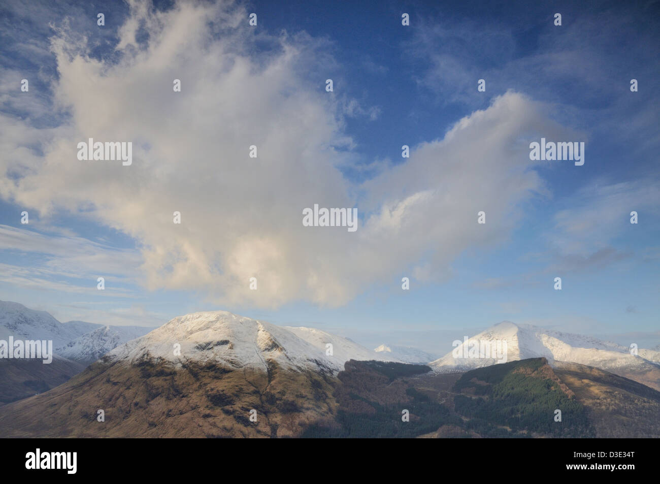 Dramatic cloud above snow capped Meall Mor, Glencoe, Scottish Highlands Stock Photo