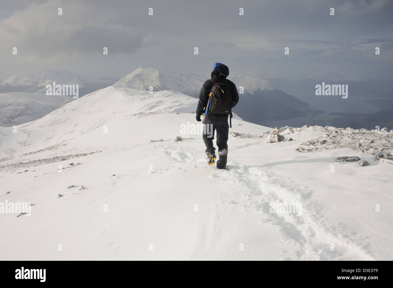 Winter mountain walking in Scotland. Male walker on the summit of Sgorr nam Fiannaidh in Glencoe Stock Photo