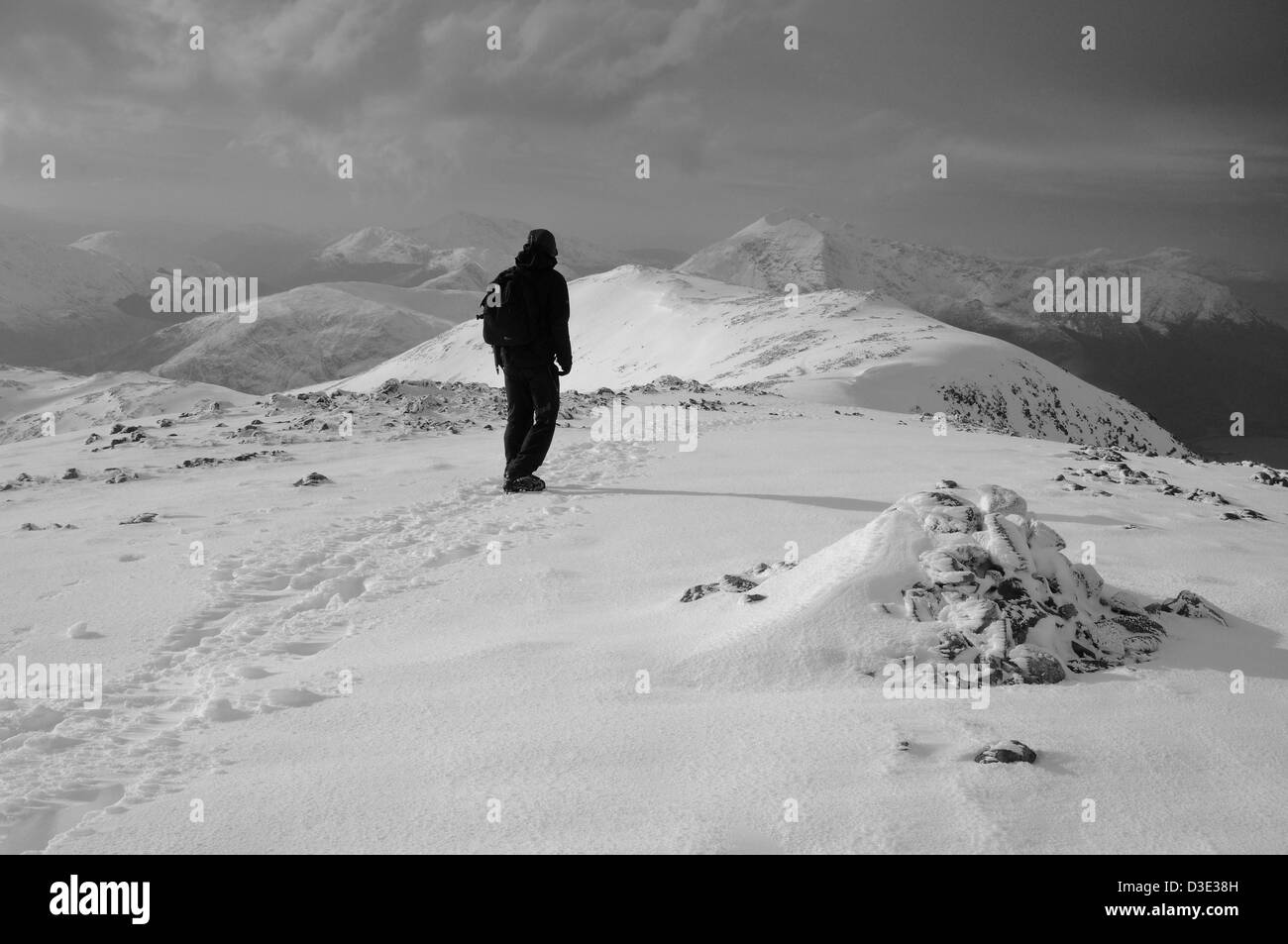 Lone walker on the summit of Sgorr nam Fiannaidh, Glencoe, Scottish Highlands, Scotland Stock Photo