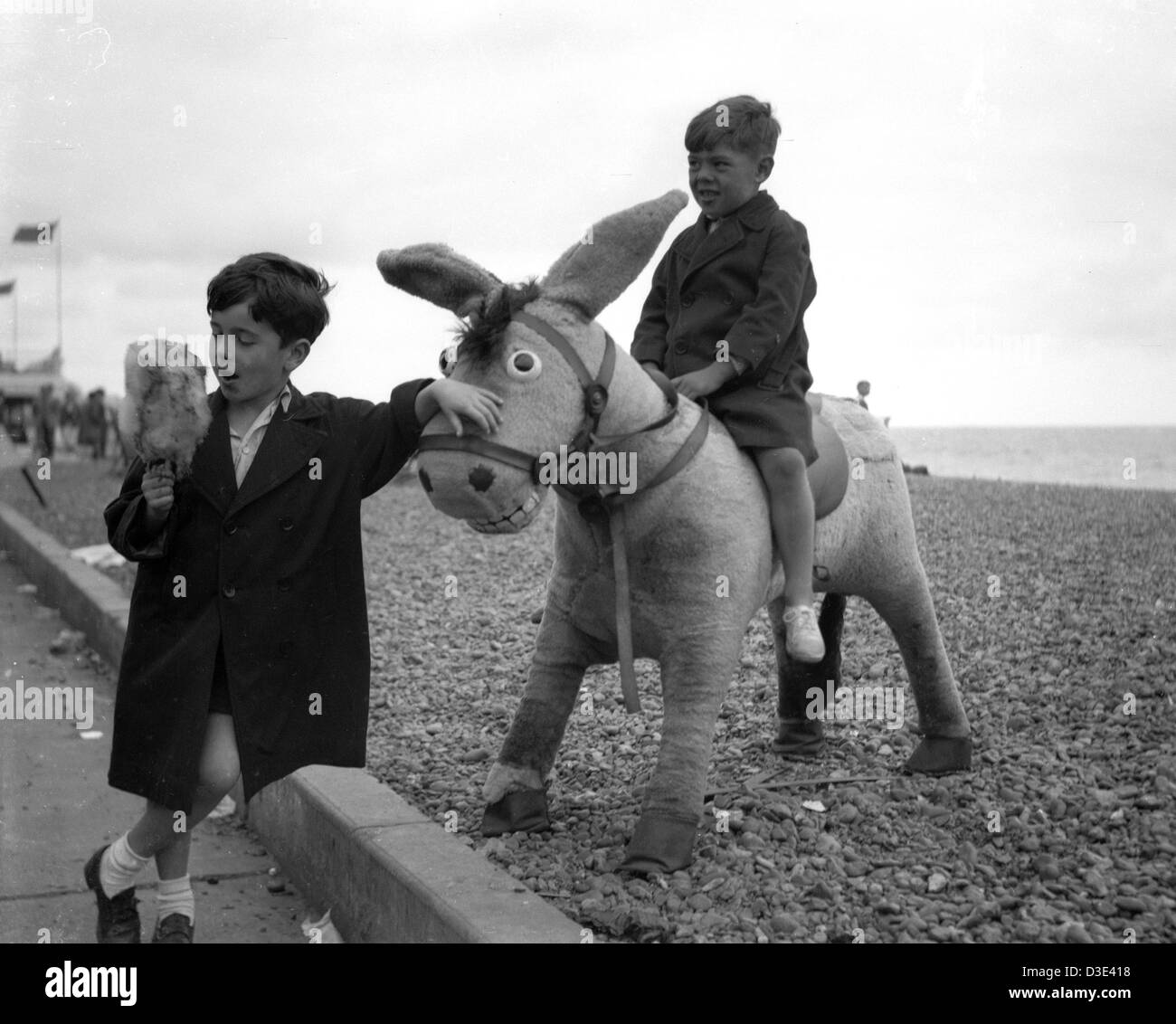 Two boys on Brighton beach, circa 1950's Stock Photo