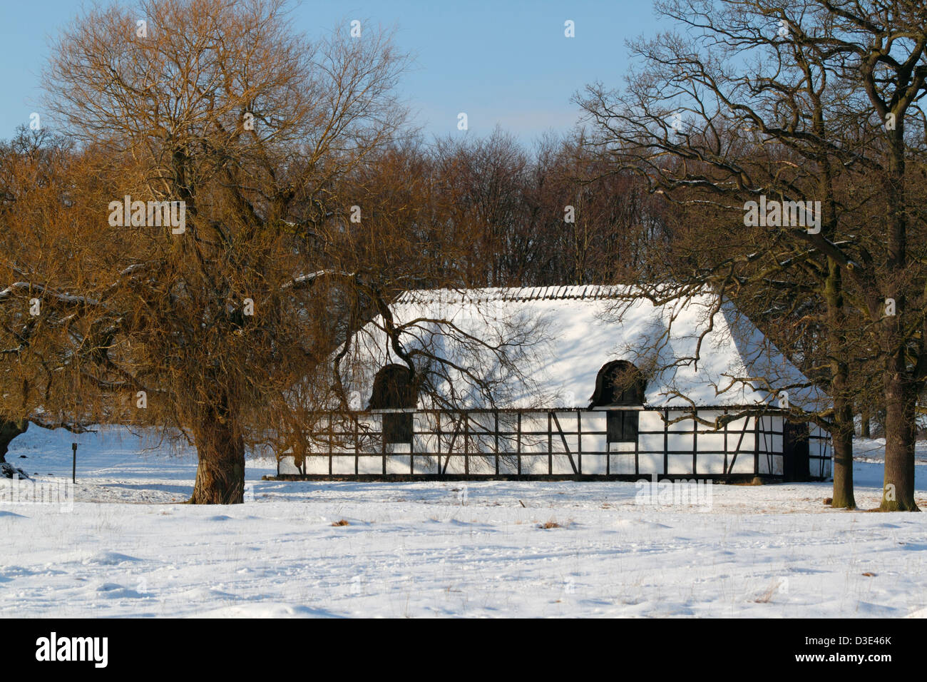 Old thatched barn, stable, service building close to the Eremitageslot, the Hermitage Castle, in Dyrehaven, Snow, at winter. Stock Photo