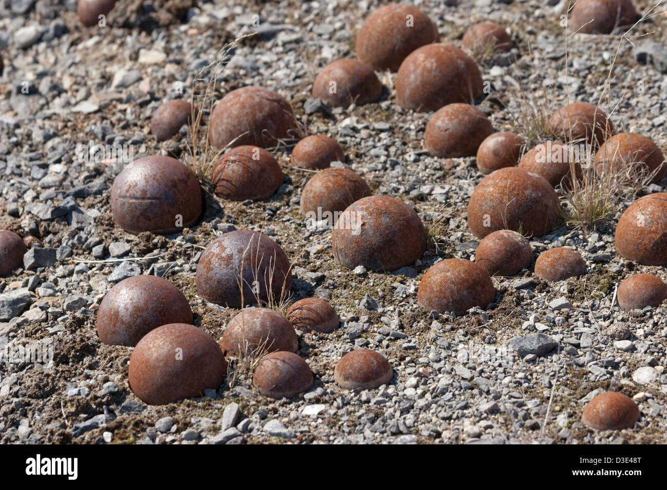 steel balls buried in ground mining pulverizing Stock Photo Alamy