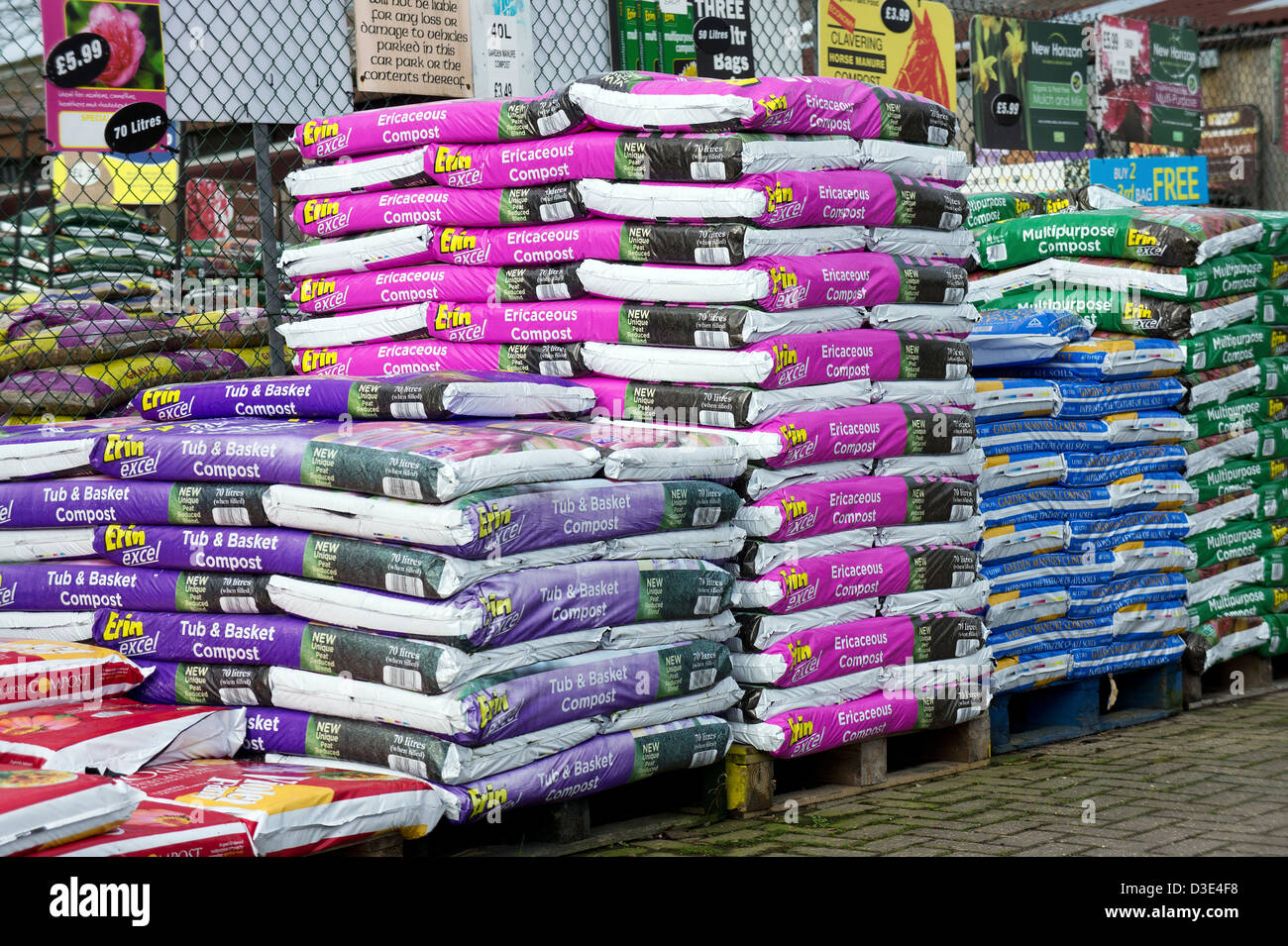 Bags of compost on sale at a garden centre Stock Photo Alamy