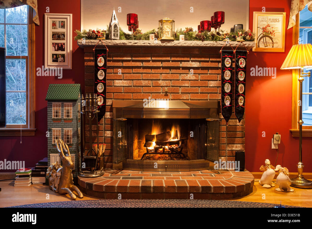 Cozy Family Room with Fire in Fireplace , Christmas Season, USA Stock Photo