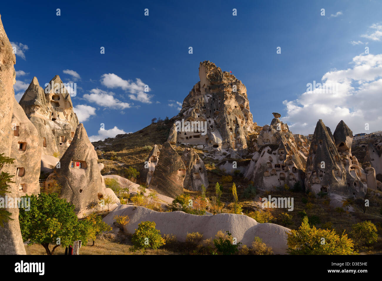 Ancient Uchisar Castle houses and tunnels at sunset carved out of volcanic tuff Cappadocia Turkey Stock Photo