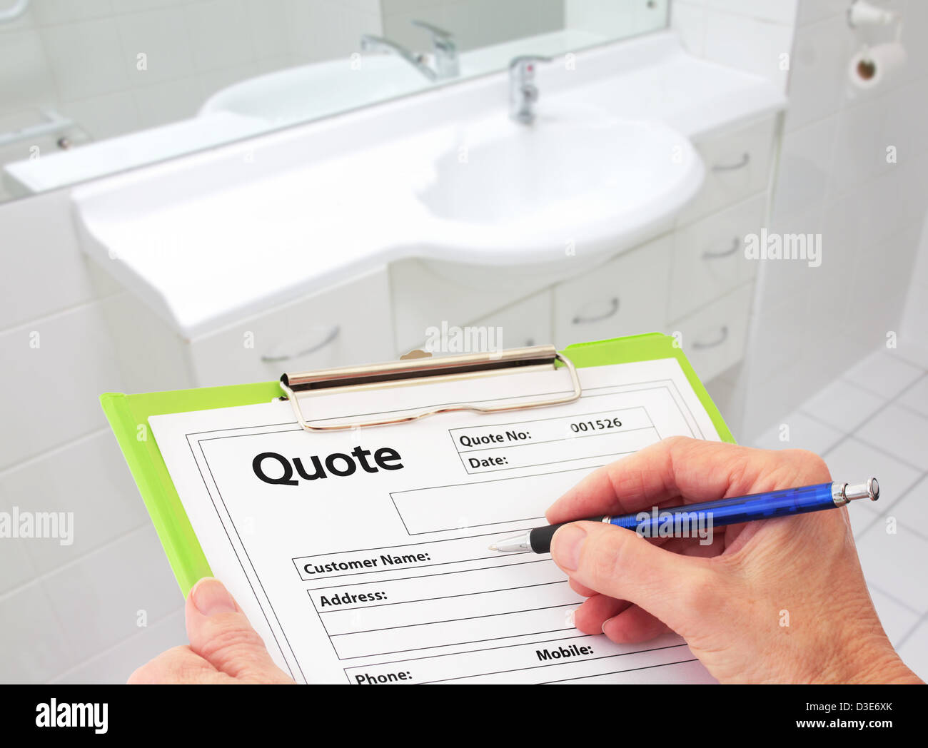 Hand Writing a Quote for Bathroom Renovation Stock Photo