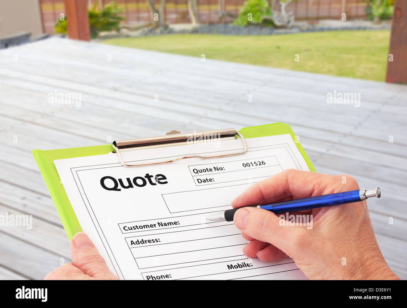 Hand Writing a Quote for Deck Renovation Stock Photo