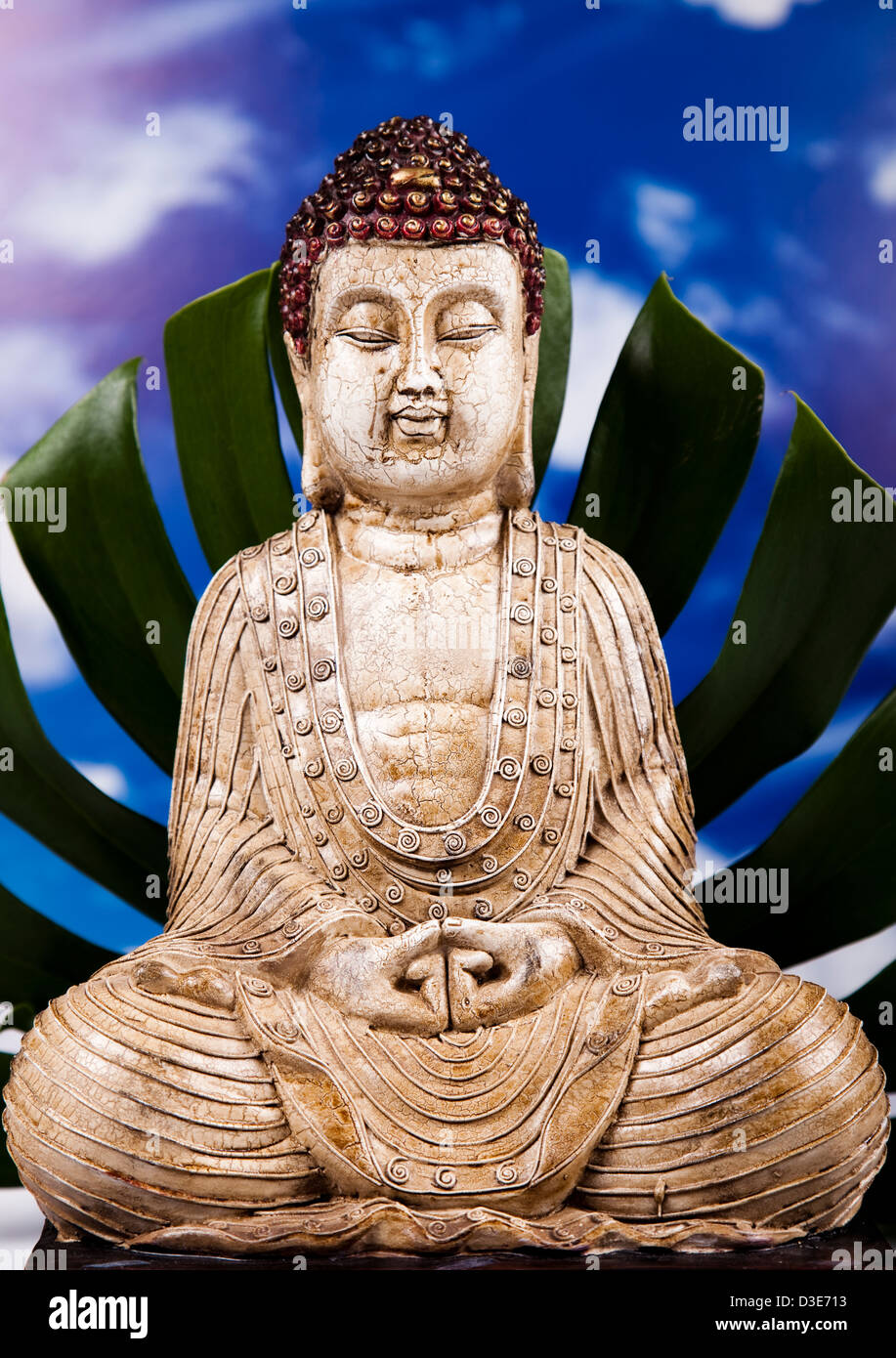 Buddha and blue sky background Stock Photo - Alamy