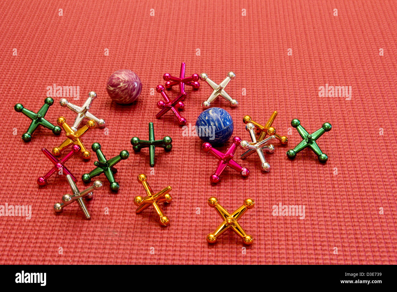 vintage toy jacks and balls on a rubber mat Stock Photo