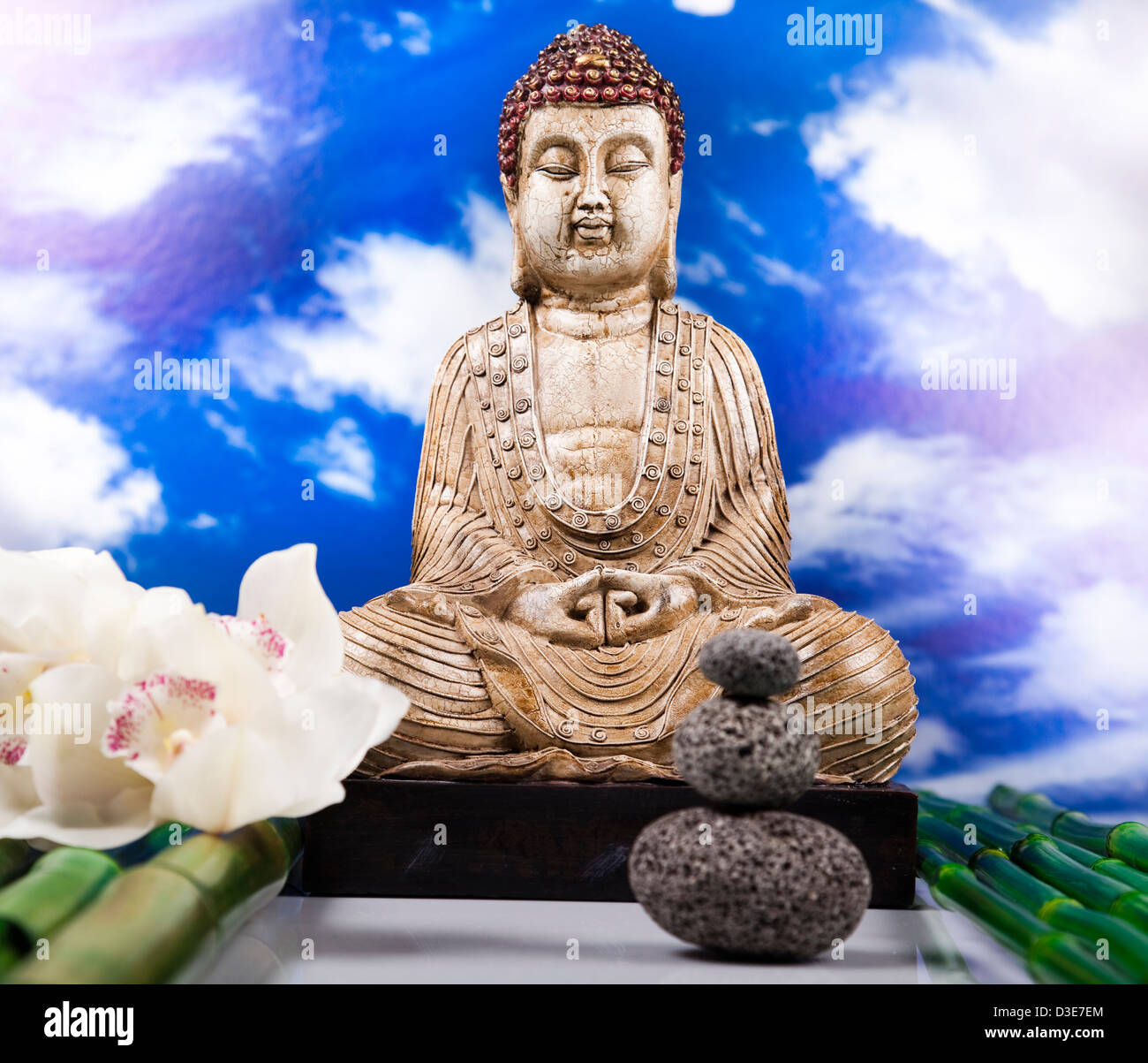 Buddha and blue sky background Stock Photo - Alamy