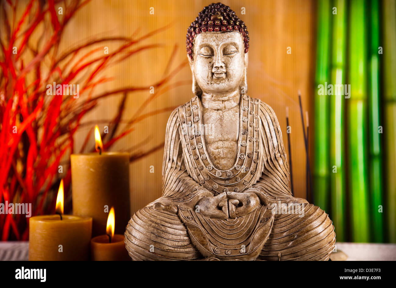 Buddha with candle Stock Photo - Alamy