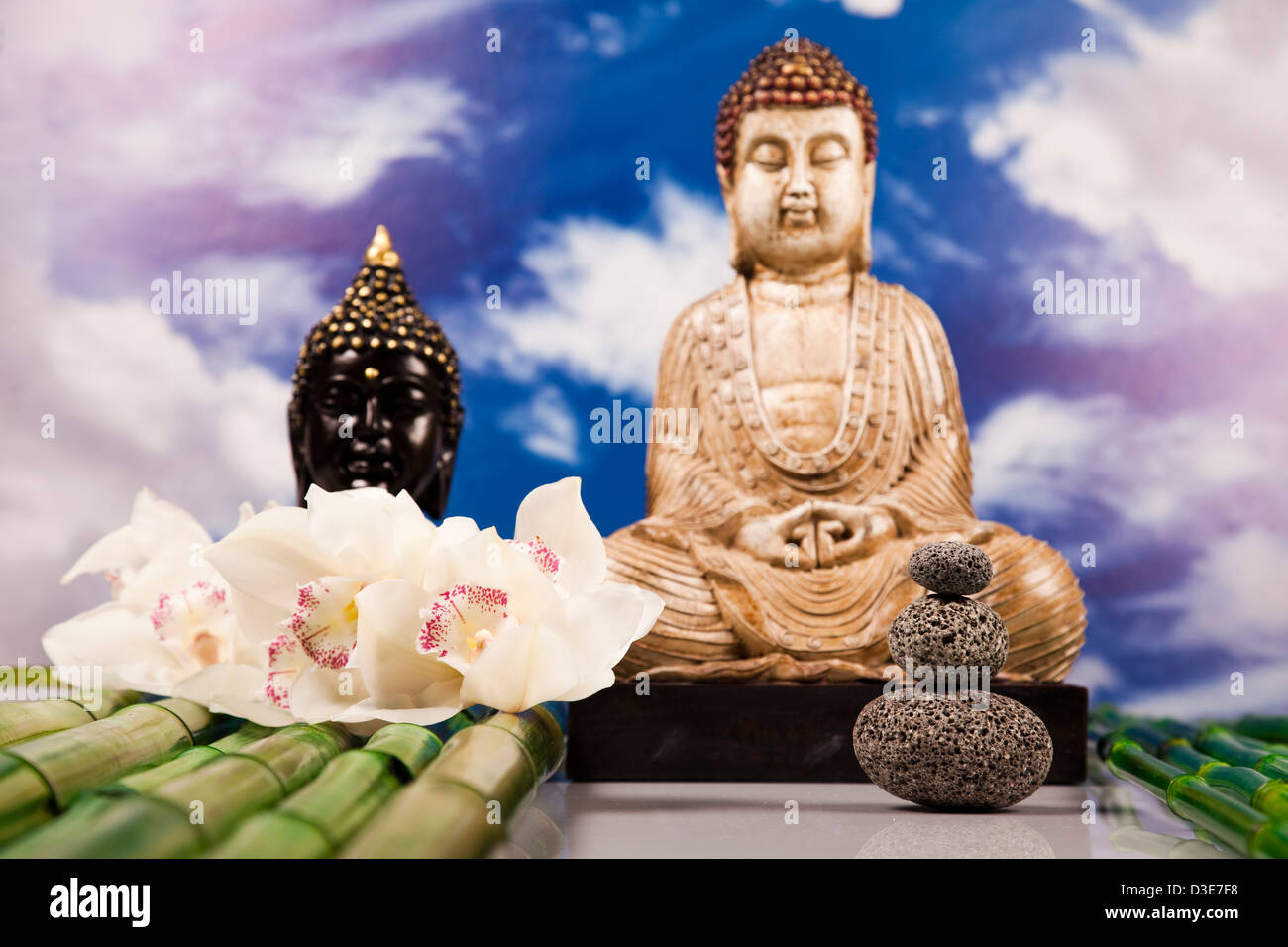 Buddha and blue sky background Stock Photo - Alamy