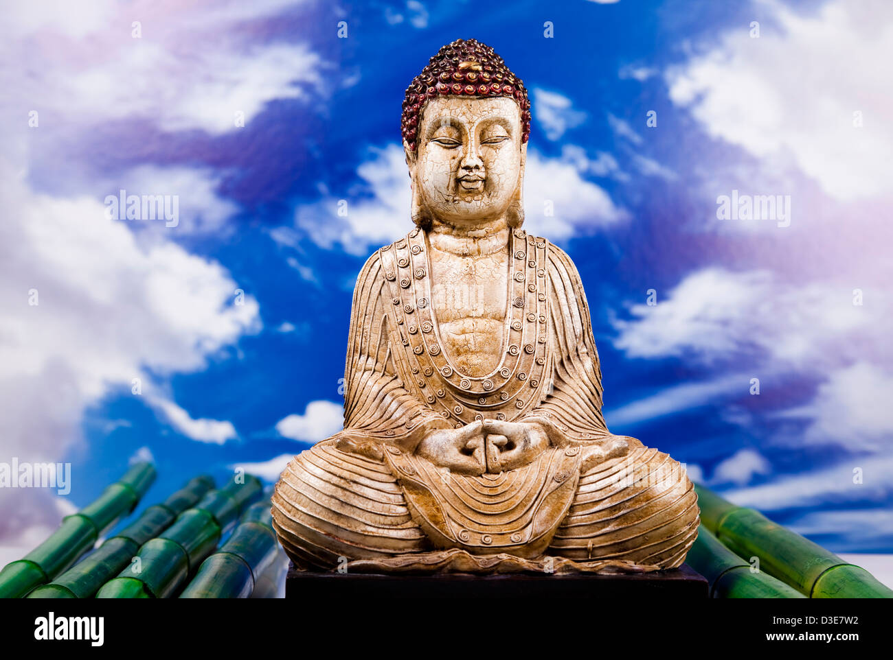 Buddha and blue sky background Stock Photo - Alamy