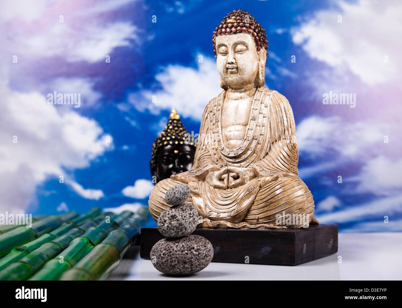 Buddha and blue sky background Stock Photo - Alamy