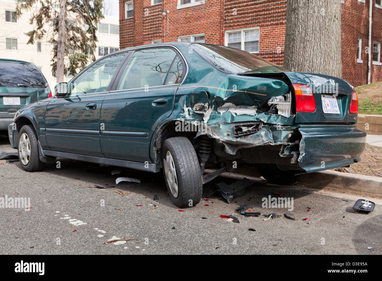 Car with rear quarter panel damage in hit and run accident USA Stock