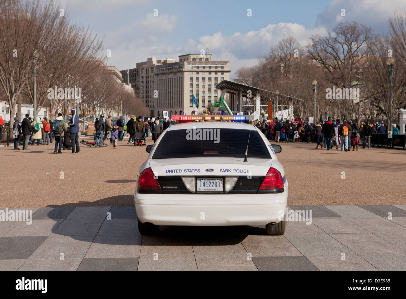 US National Park Police car behind a crowd of demonstrators - Washington, DC USA Stock Photo