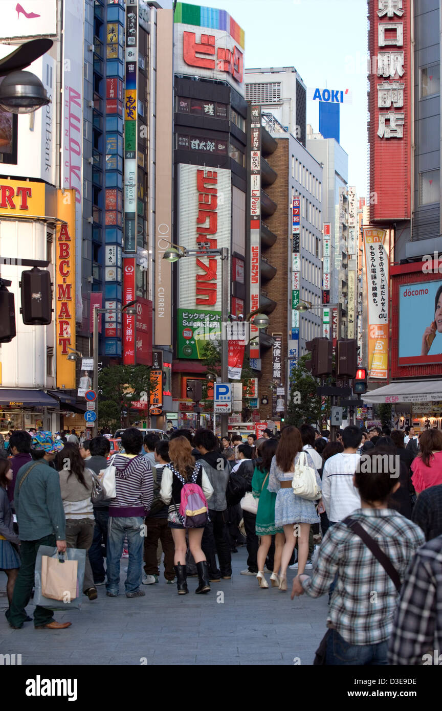 Shoppers crowd the streets of the East Shinjuku shopping and entertainment district in downtown Tokyo. Stock Photo