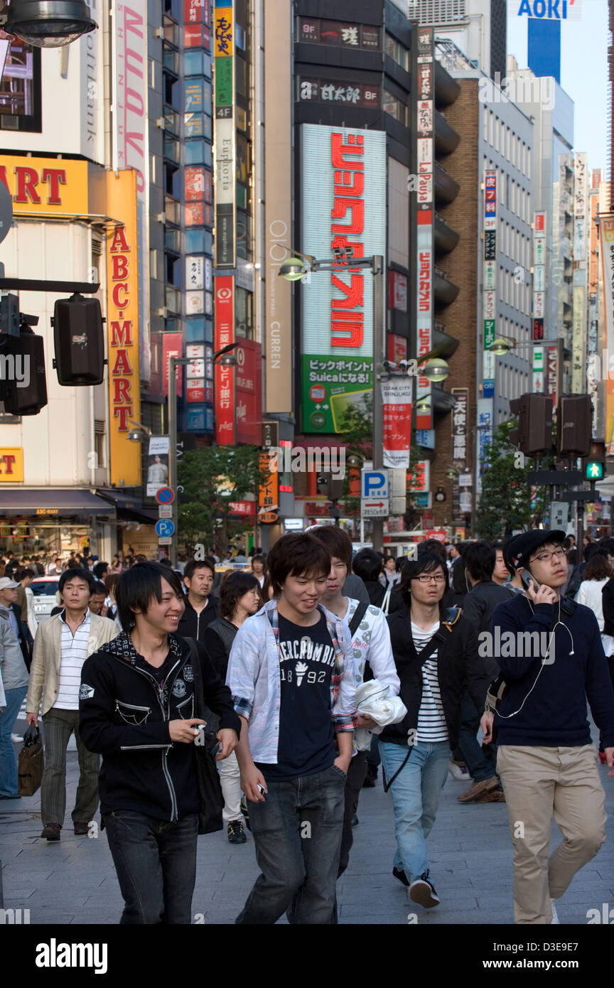 Shoppers crowd the streets of the East Shinjuku shopping and entertainment district in downtown Tokyo. Stock Photo