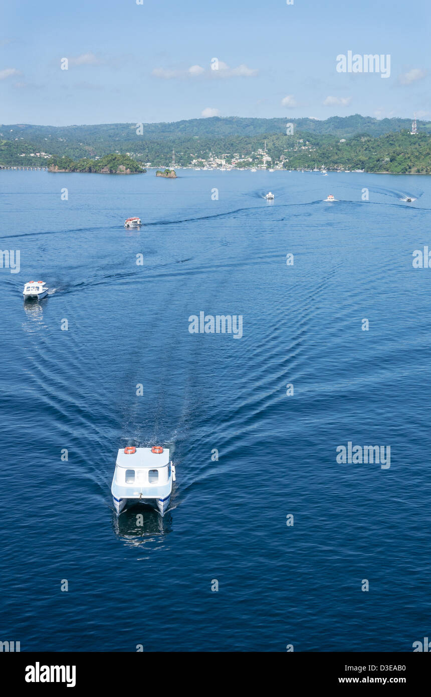 Samana, Dominican Republic, Tender boats transfer passengers ashore for a day of sight seeing Stock Photo