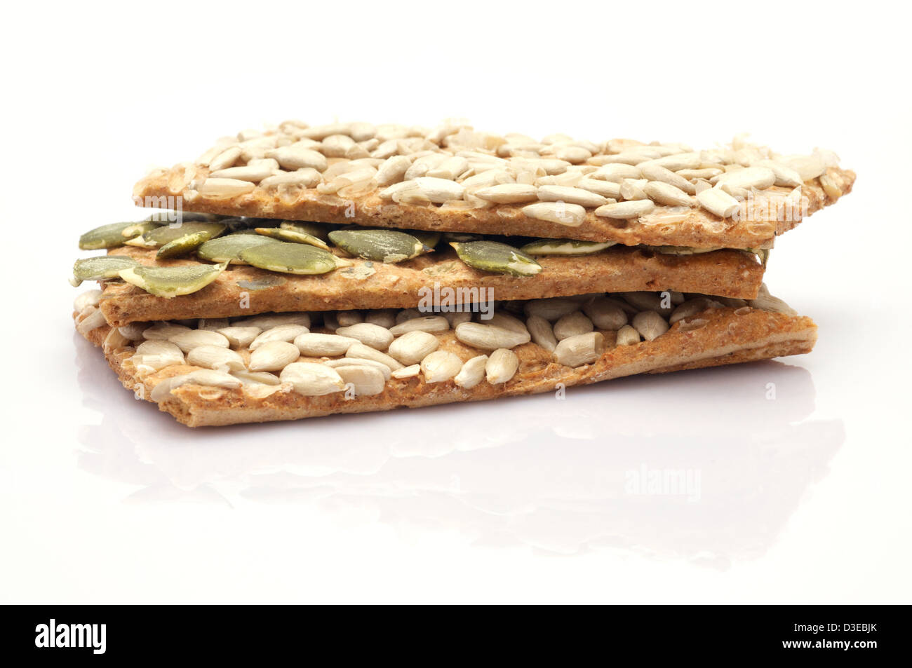 A stack of sunflower seeds cracker on white background Stock Photo Alamy
