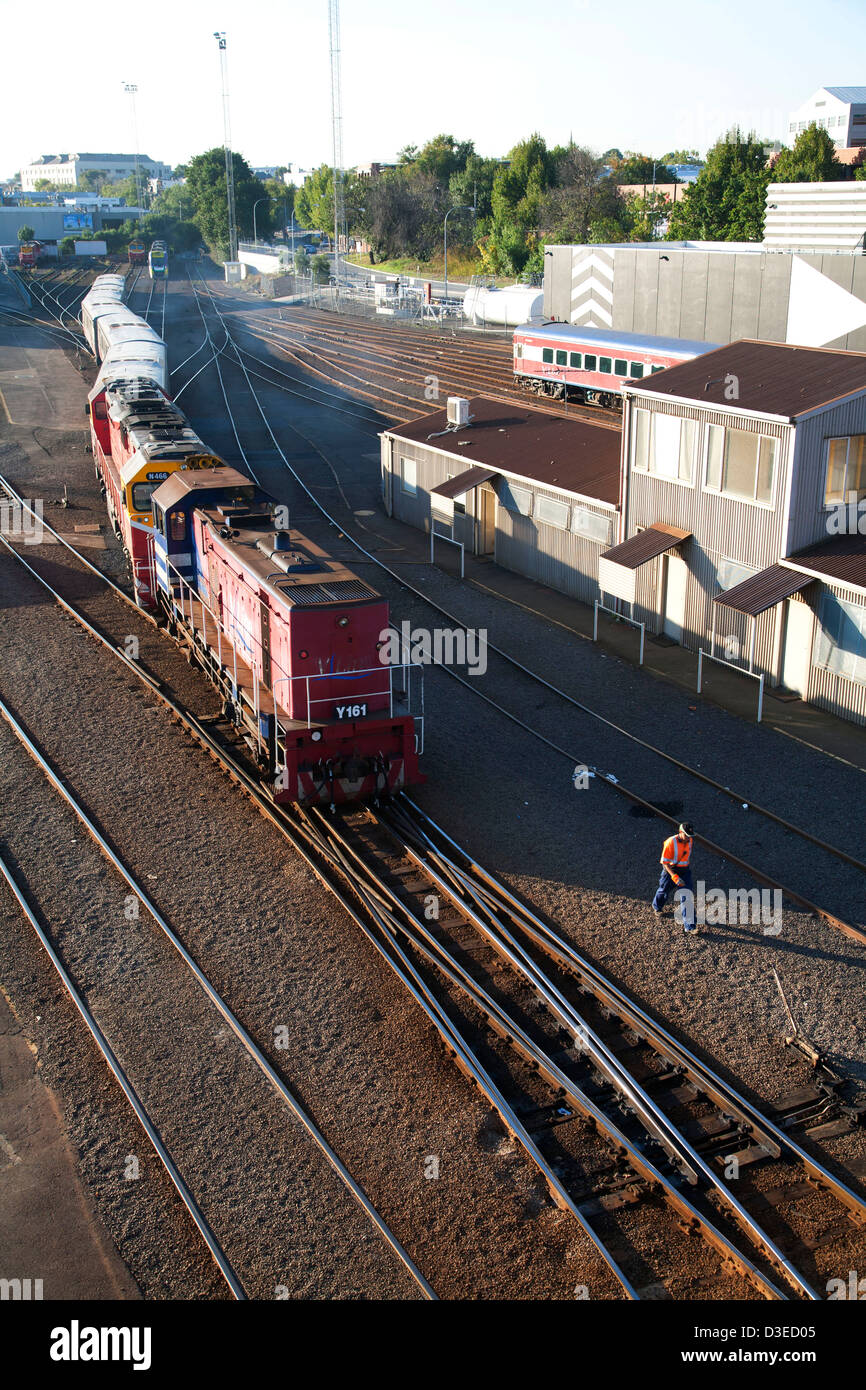 railway worker mainly changing the points in shunting yard Southern Cross Station Melbourne Victoria Australia Stock Photo