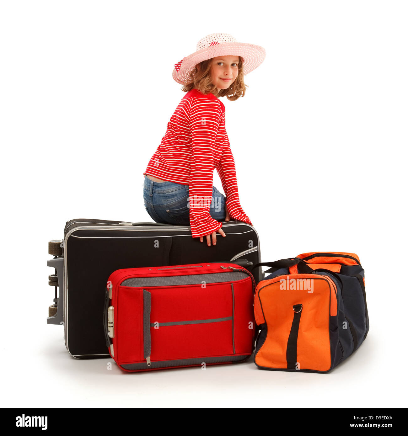 Girl sitting on luggages, ready to trip Stock Photo