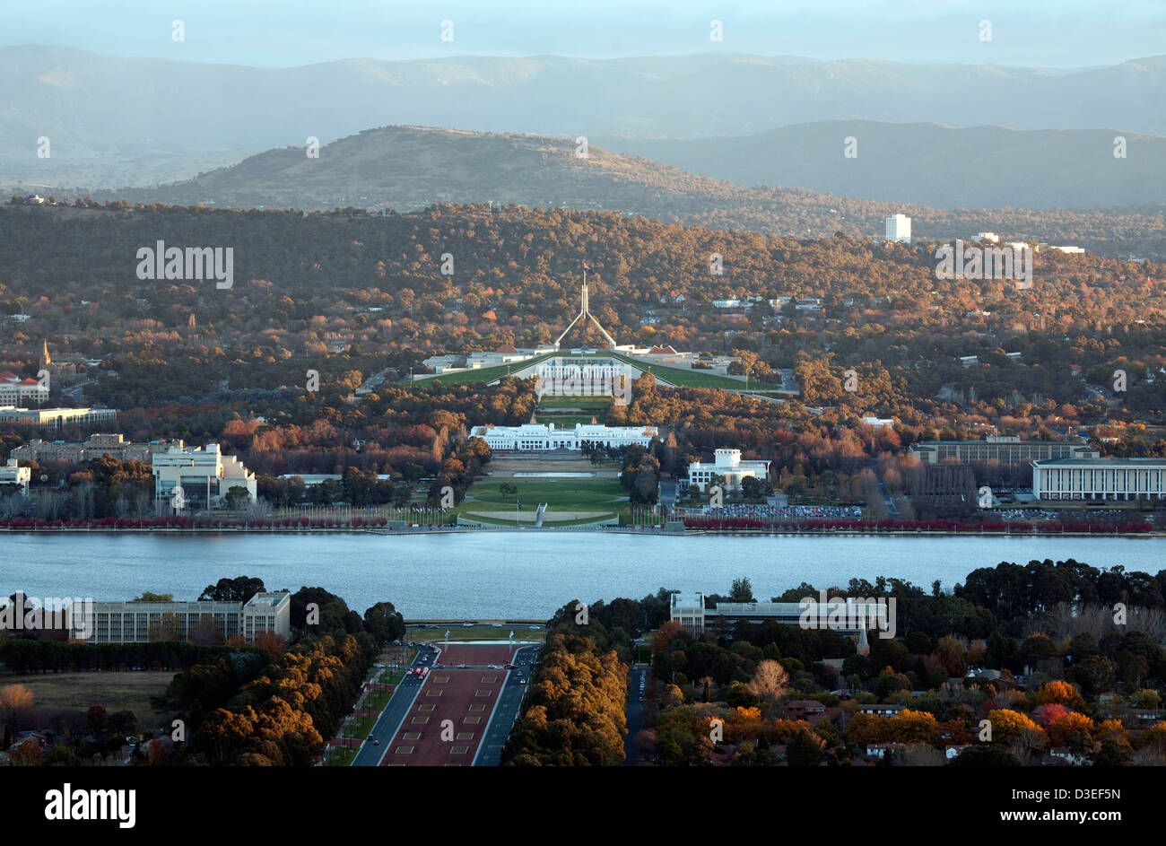 Elevated aerial view looking across Lake Burley Griffin to the Australian Houses of Parliament on an autumn day. Stock Photo