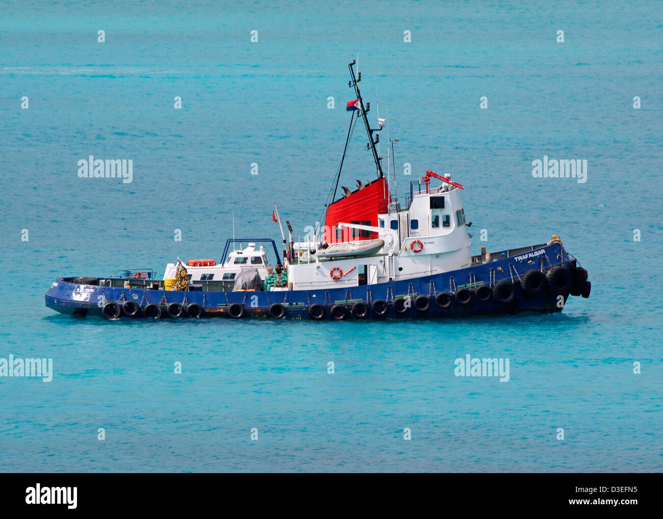 TRADITIONAL TUGBOAT IN TROPICAL  WATERS Stock Photo