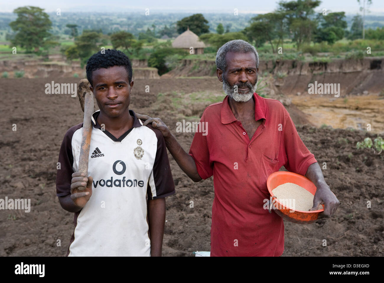 JAFFA VILLAGE, WOLAYITA ZONE, ETHIOPIA, 19TH AUGUST 2008: Farmer sows tef crop on his badly eroded field Stock Photo