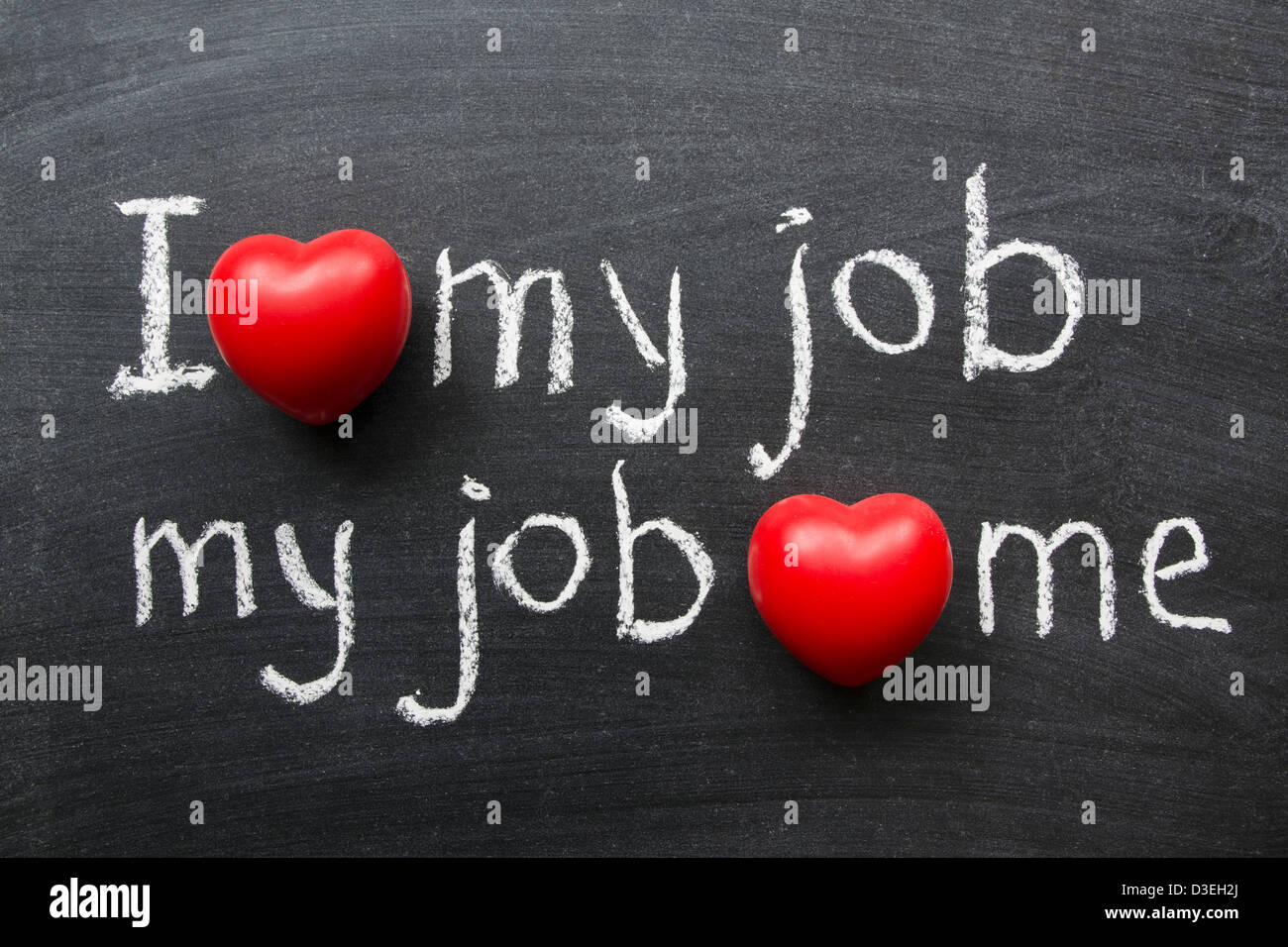 I love my job - positive concept handwritten on black chalkboard with volume red heart symbol Stock Photo
