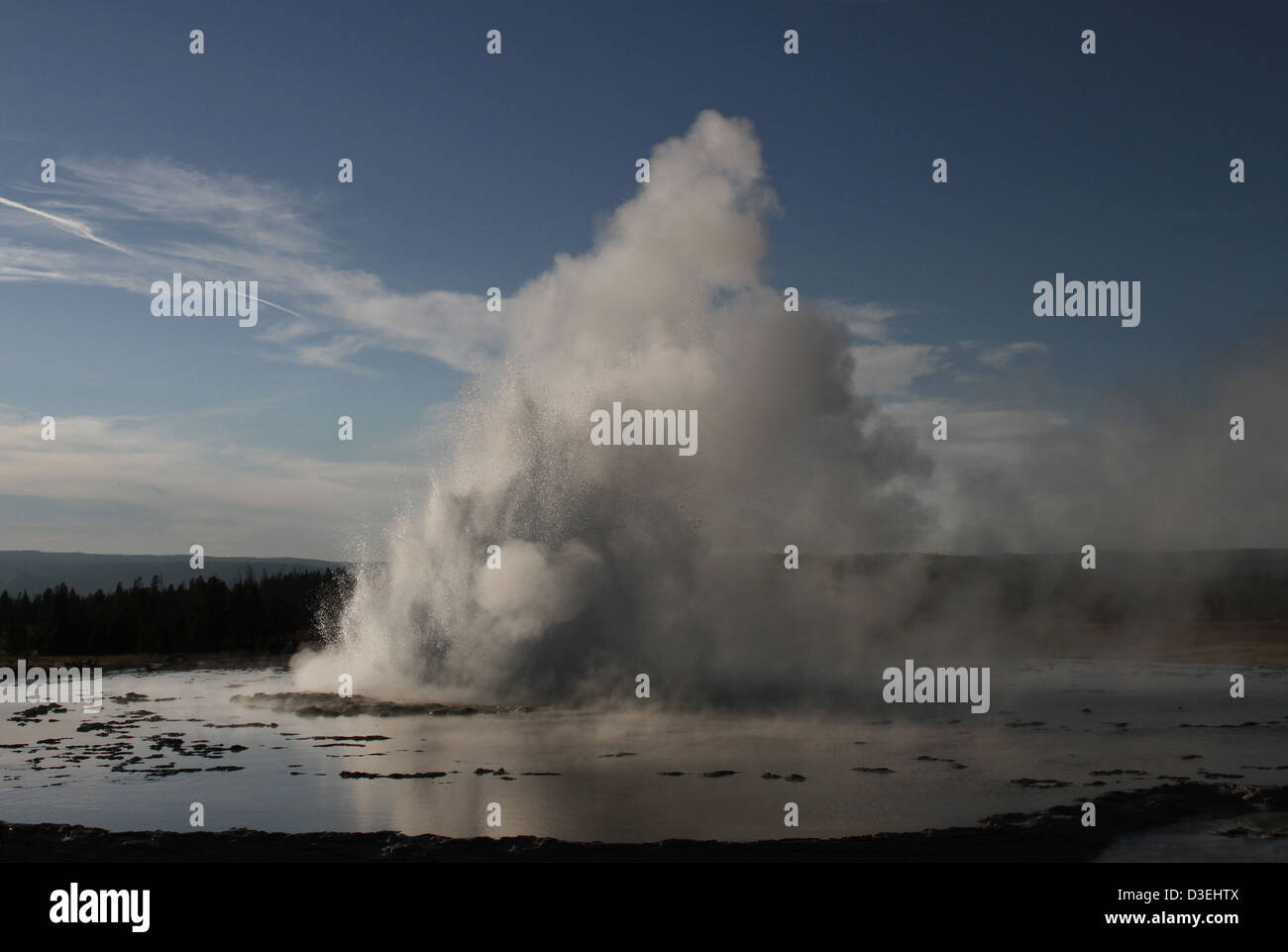 Great Fountain Geyser, located in Yellowstone National Park, is known for its impressive eruptions, which occur at irregular intervals. This geothermal feature adds to the park's renowned geothermal activity and offers visitors a spectacular natural display. Stock Photo