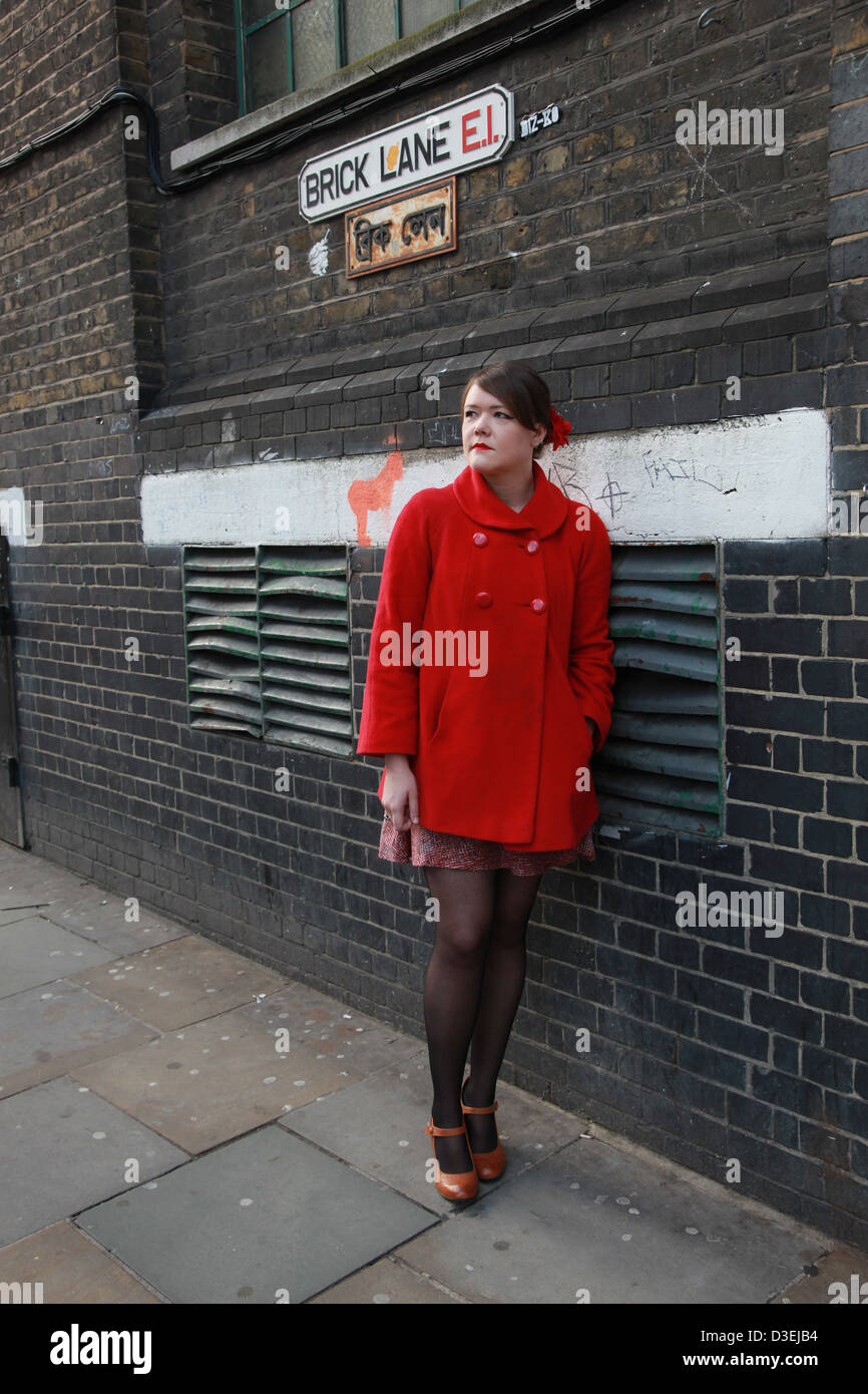 Woman waiting for someone in Brick Lane London Stock Photo