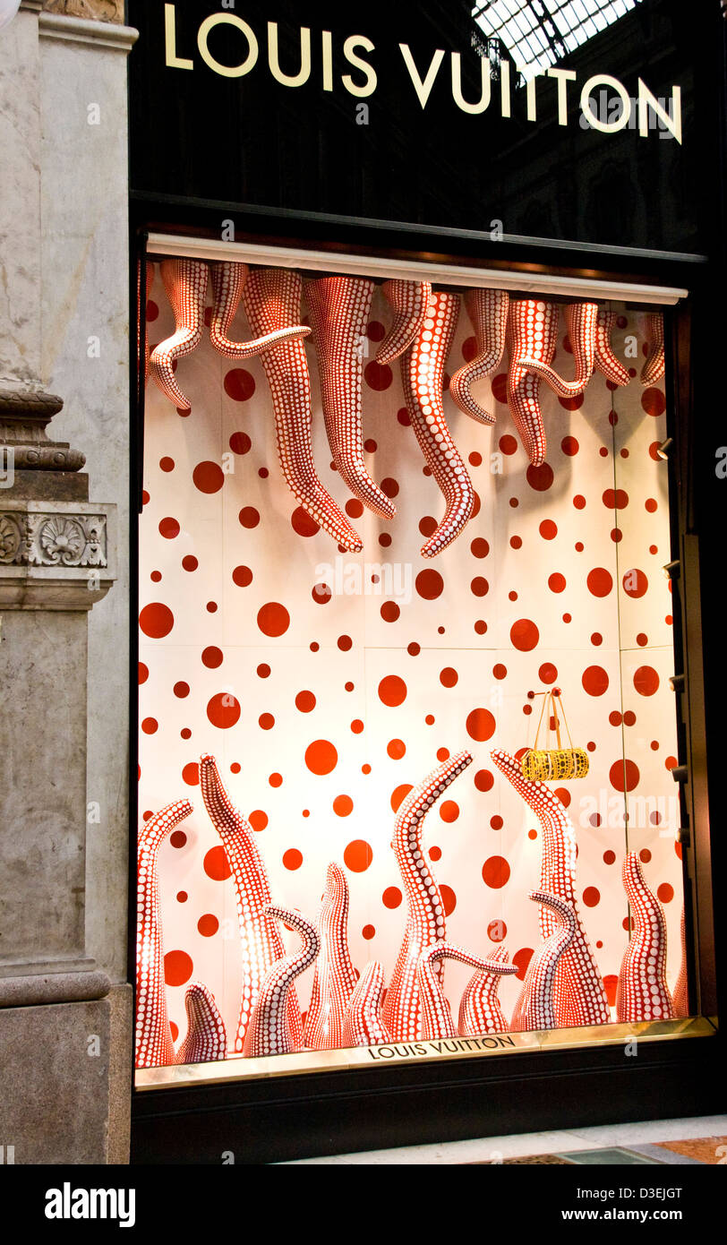 Yellow handbag in Louis Vuitton boutique designer window display Galleria Vittorio Emanuele II Milan Lombardy Italy Europe Stock Photo
