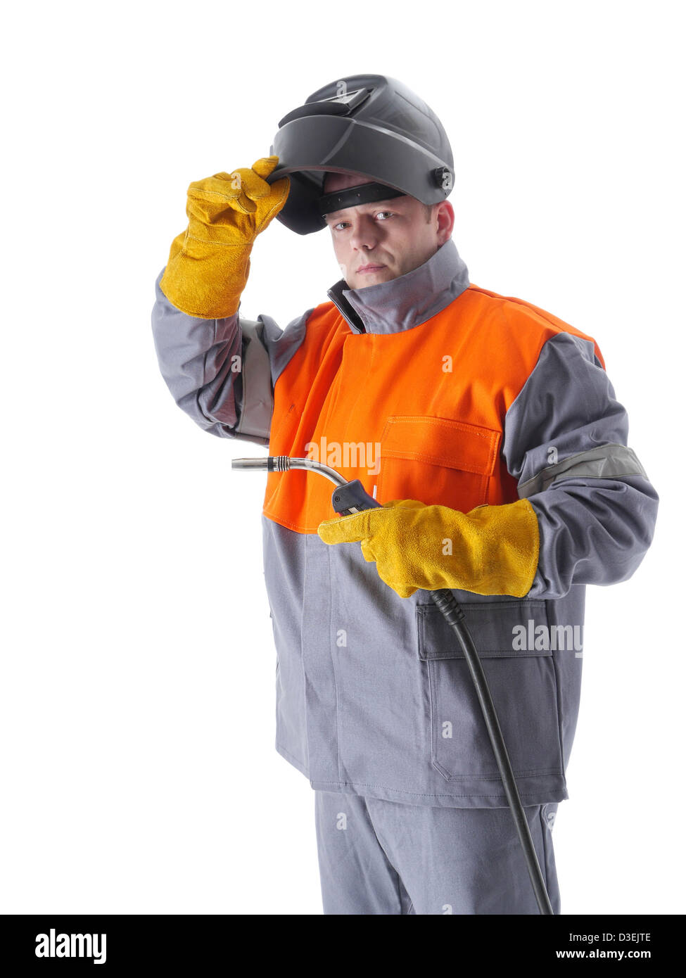 Welder wearing protective suit and welding hood holding gas welding gun on white Stock Photo