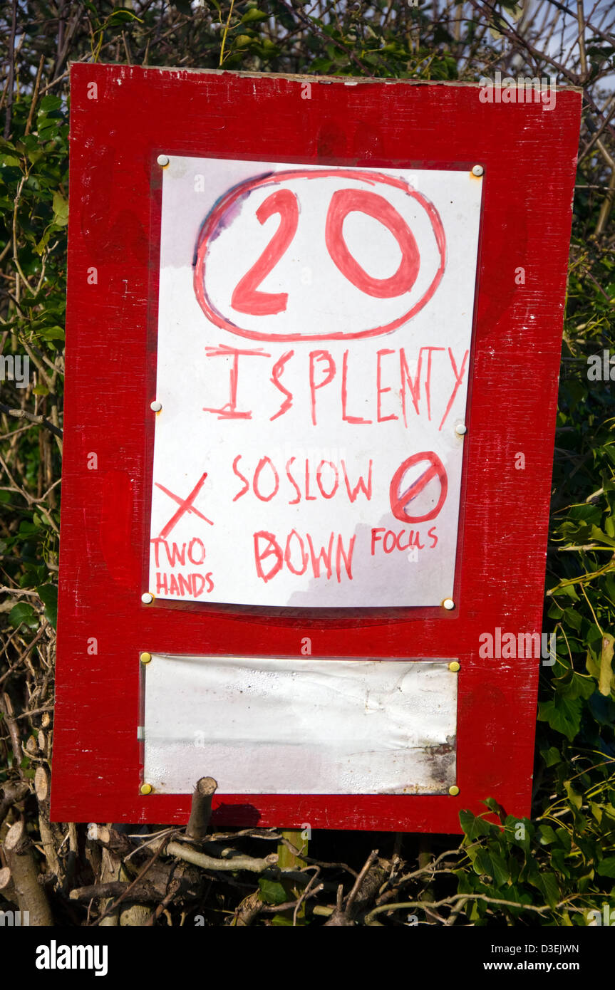 Hand written roadsign speed restriction urging 20mph limit on a rural road in Somerset 20 is plenty Stock Photo