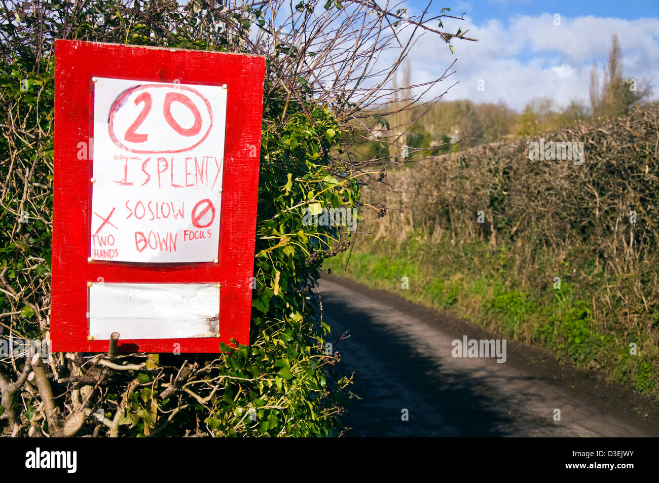 Hand written roadsign speed restriction urging 20mph limit on a rural road in Somerset 20 is plenty Stock Photo
