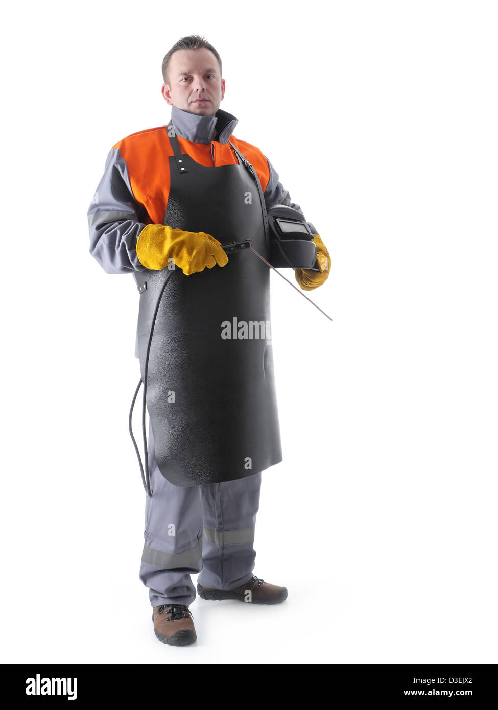 Portrait of welder wearing protective welding black leather apron, welding hood and welding electrode holder over white Stock Photo